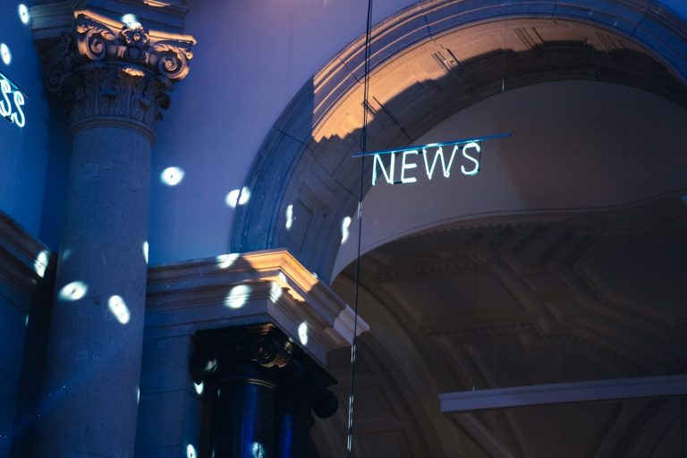 a building with a sign on the roof